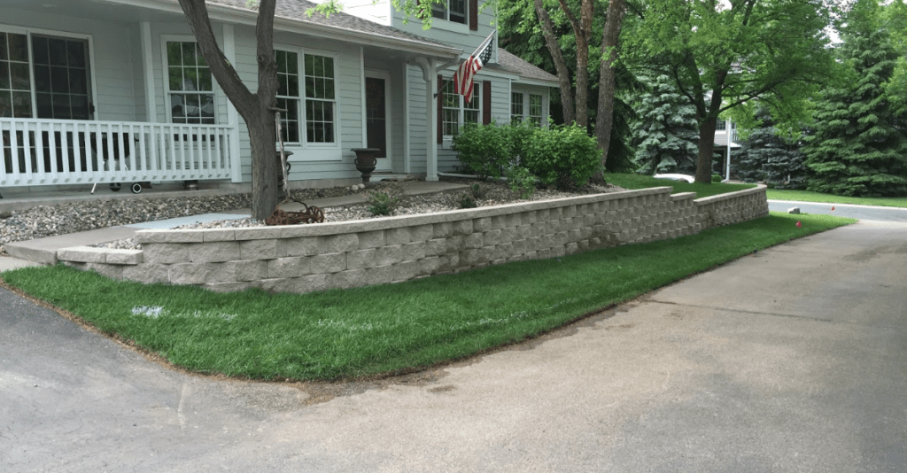 front entry landscaping with retaining wall